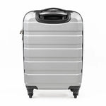 The back of a silver suitcase with black handle and wheels on a white background