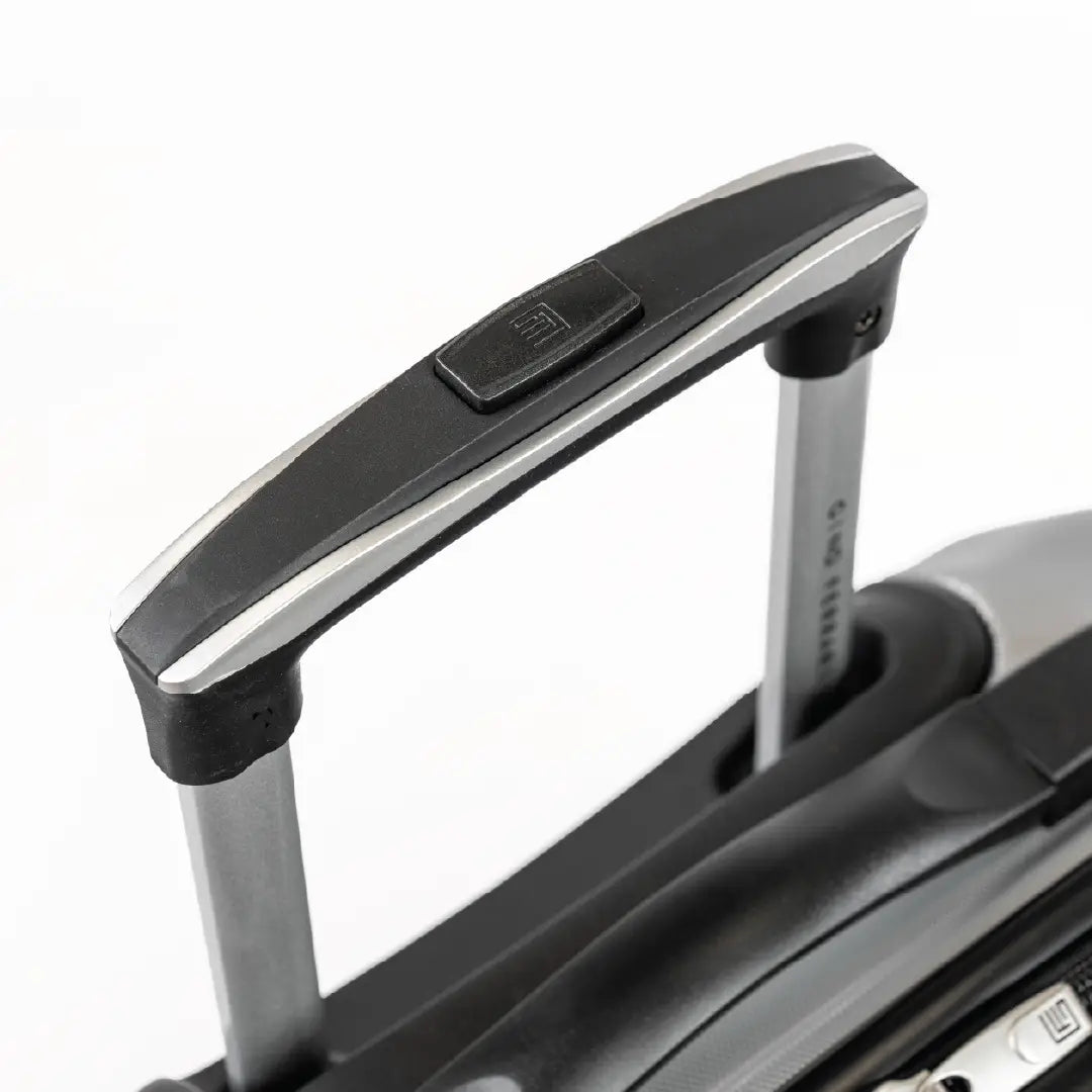 Close-up of a suitcase handle on a white background