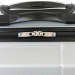 Close-up of a suitcase handle and zipper on a silver suitcase