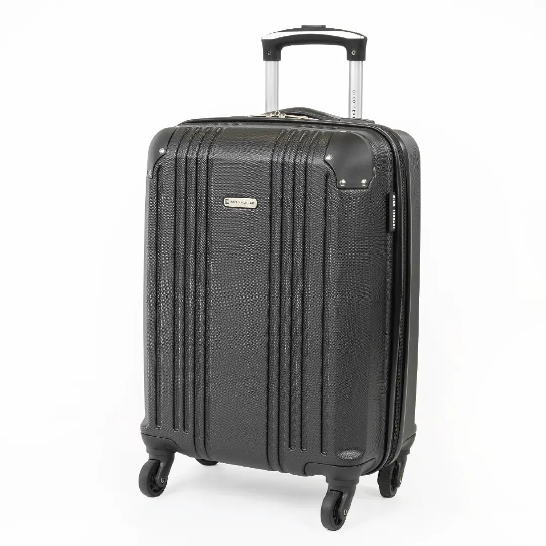 Black suitcase with wheels and handle on a white background