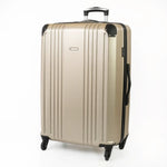 Gold hard-shell suitcase with a visible brand logo and black accents.