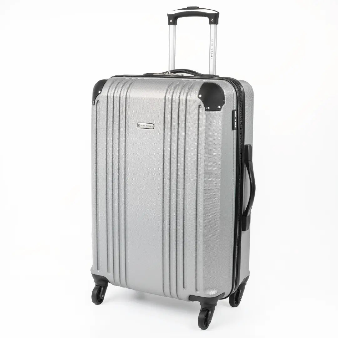 Cabin-sized silver hard-shell suitcase with a visible brand logo and black accents.