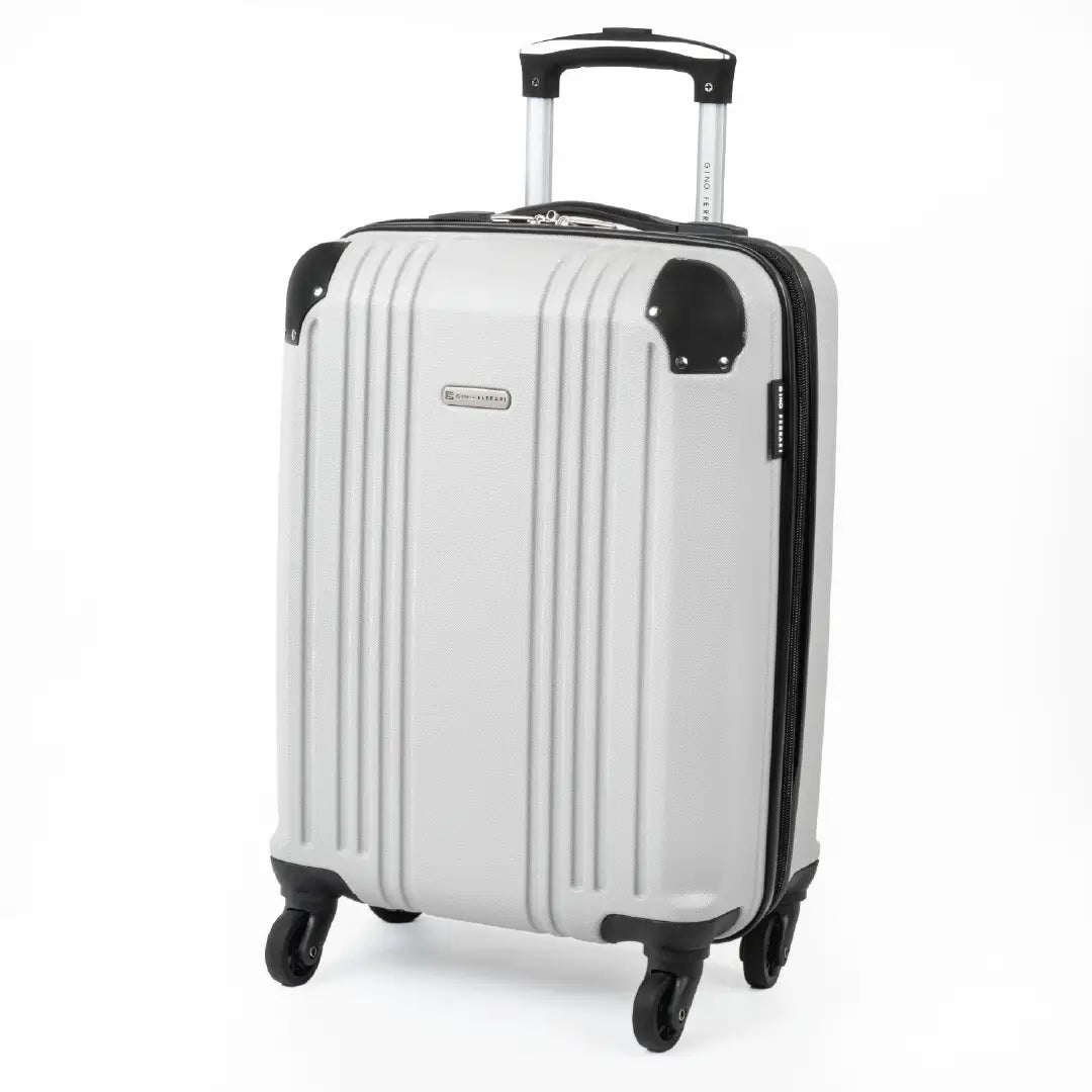 Cabin-sized silver hard-shell suitcase with a visible brand logo and black accents.