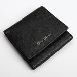 A black textured leather bifold wallet with a silver-tone script logo reading 'Gino Ferrari' on the front flap, shown on a clean white background.