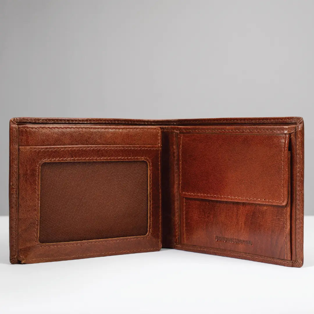 An open brown leather bi-fold wallet with multiple card slots, a slip pocket, and an ID window, shown against a neutral gray background.