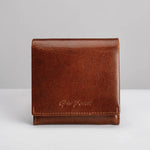 A brown leather bifold wallet with a debossed 'Gino Ferrari' logo on the front, displayed on a clean light grey background.
