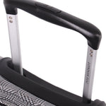 Close-up of a suitcase handle with 'London Fog' branding on a white background