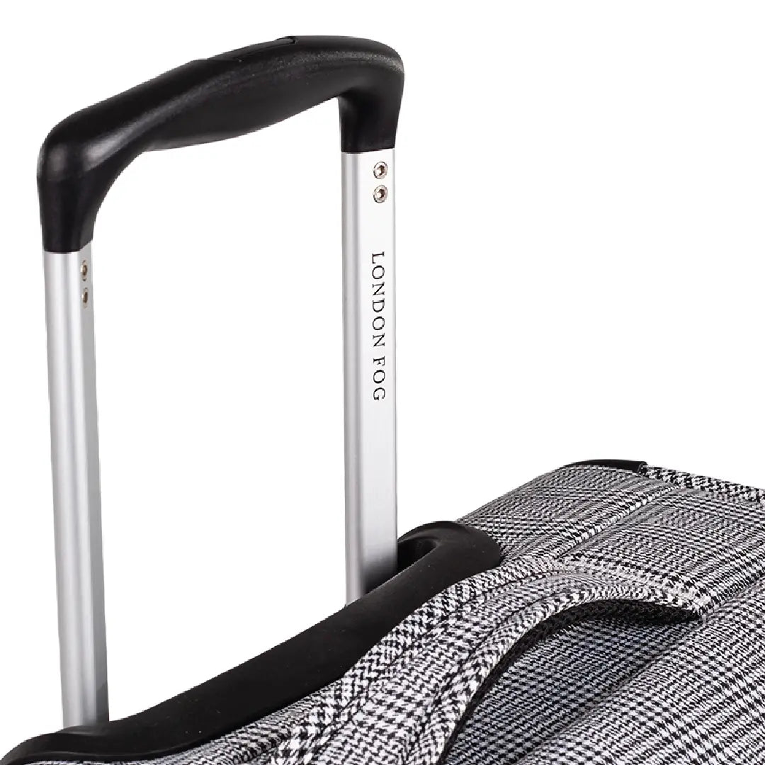 Close-up of a suitcase handle with 'London Fog' branding on a white background