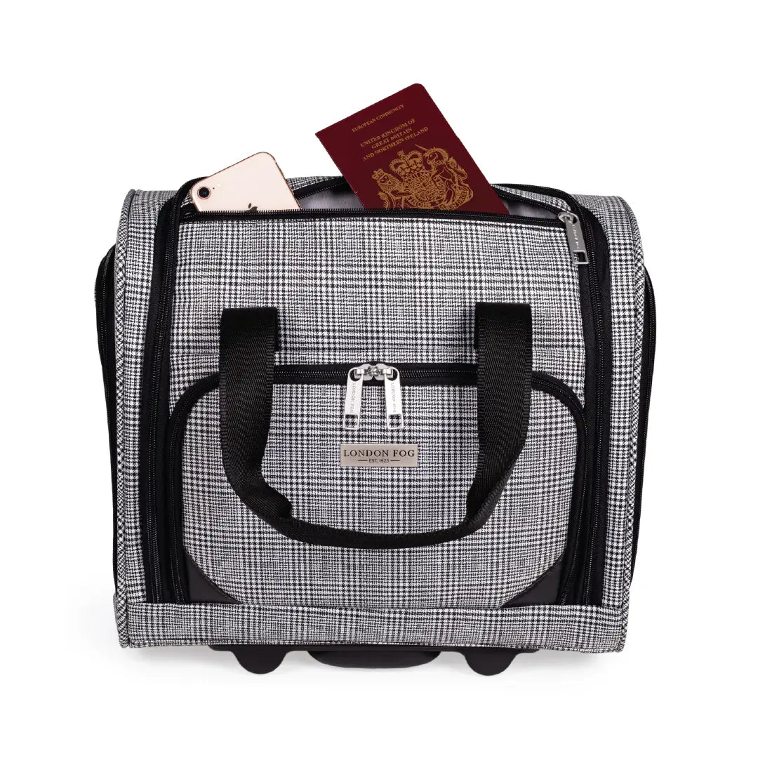 Black and white checkered travel bag with a passport and phone on a white background