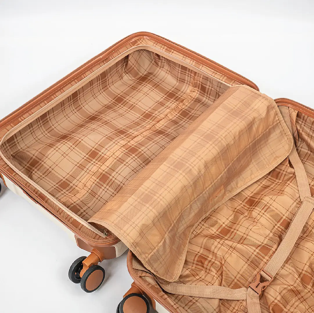 Open suitcase with plaid interior on a white background