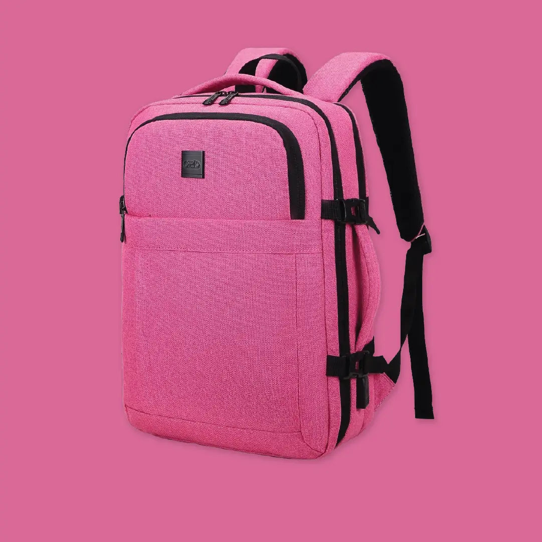 Pink backpack with black straps on a pink background